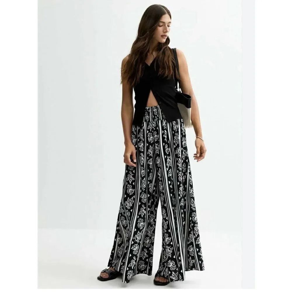 New Look FLORAL PRINT - Trousers - WideโLeg High Rise 2 Pockets Womenโs L